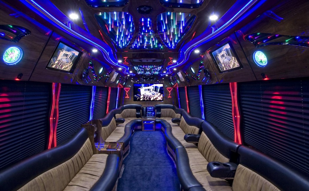Luxury limousine interior with plush seating, LED lighting, and entertainment screens, showcasing premium Special Event Rides for parties and VIP celebrations.