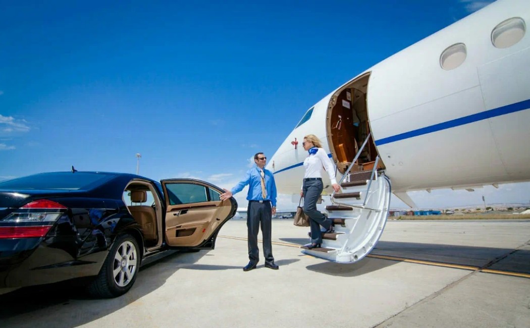 Businesswoman greeted at a private jet, stepping into a luxury car, showcasing professional Airport Transportation Services.