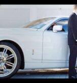 Bride stepping out of a luxury white car with the groom assisting her, showcasing elegant Wedding Transportation Services for a special day.